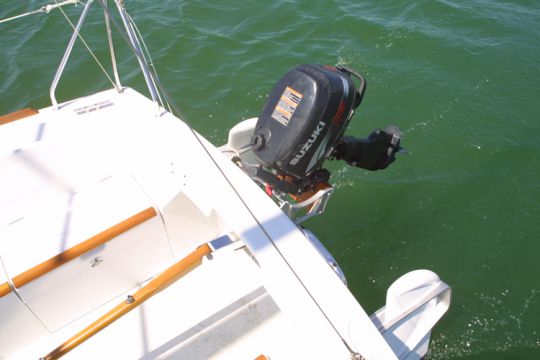 sailboat propelled by an outboard motor