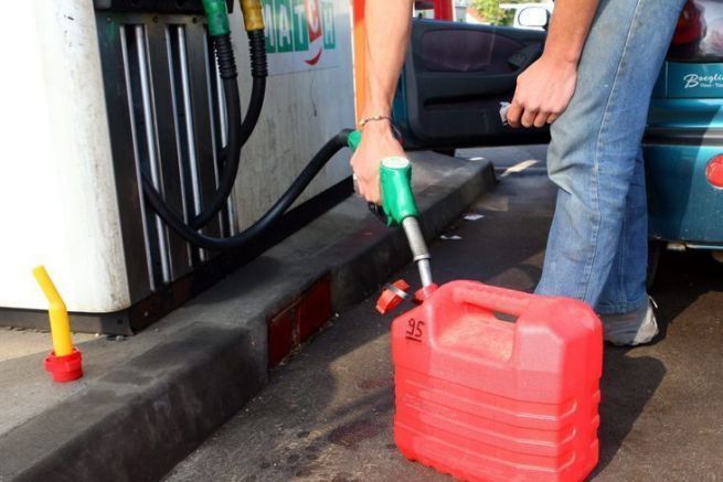 How do you safely fill a gas can before filling up your boat?